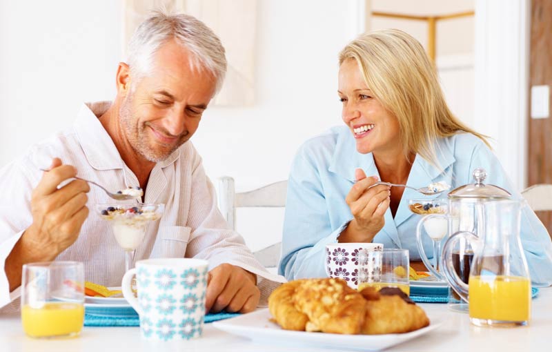 Older couple enjoying a healthy breakfast aging elegantly